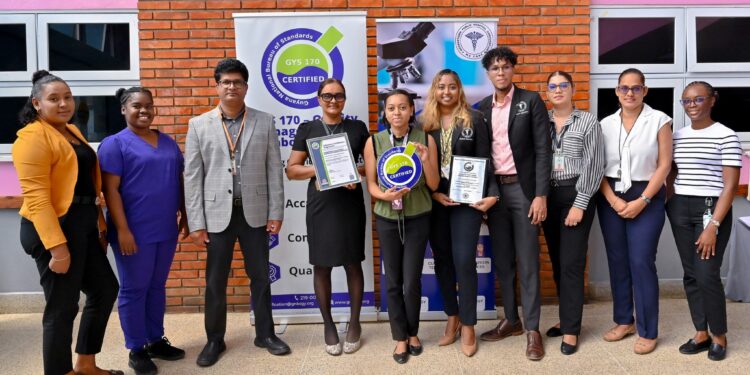Representatives from Georgetown Public Hospital Corporation pose with the GYS 170 Certificate and Plaque