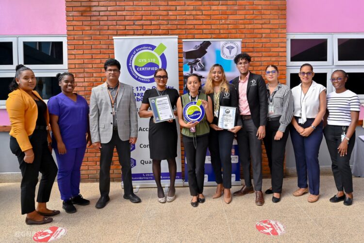 Representatives from Georgetown Public Hospital Corporation pose with the GYS 170 Certificate and Plaque