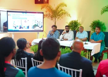 President Dr Mohamed Irfaan Ali, flanked by Barbados Prime Minister Mia Mottley and Minister of Health Dr Frank Anthony, and a member of the surgical team, speaking with reporters