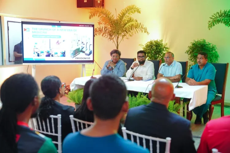 President Dr Mohamed Irfaan Ali, flanked by Barbados Prime Minister Mia Mottley and Minister of Health Dr Frank Anthony, and a member of the surgical team, speaking with reporters