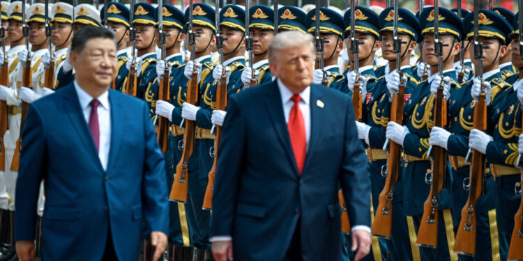 U.S. President Donald Trump reviews the troops with the President of the People’s Republic of China Xi Jinping, in Beijing, China, May 14, 2026, during a trip focused on trade, regional security, and strengthening bilateral ties between the world’s two largest economies. Kenny Holston/Pool via REUTERS