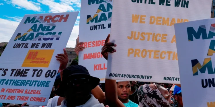 South Africans protest against illegal migration, in Johannesburg, South Africa, April 29, 2026. (AP Photo/Themba Hadebe)