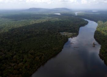 FILE - The Essequibo River flows through Kurupukari crossing in Guyana, Nov. 19, 2023. (AP Photo/Juan Pablo Arraez, File)