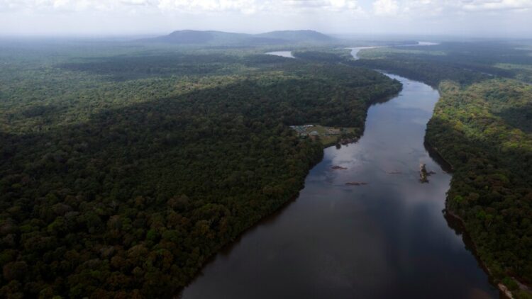 FILE - The Essequibo River flows through Kurupukari crossing in Guyana, Nov. 19, 2023. (AP Photo/Juan Pablo Arraez, File)