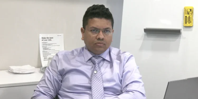 Economist Joel Bhagwandin speaking on the impacts of establishing the Guyana Development Bank