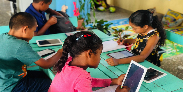 Students at the Paramakatoi Learning Pod, Region 8, engaging in a hands-on technology session, made possible through MODEC's continued sponsorship of STEMGuyana's Learning Pods programme