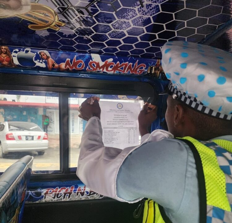 Police putting up fare structure in a minibus