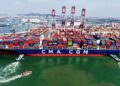 An aerial drone photo taken on June 9, 2026 shows a cargo ship berthed at Qingdao Port in Qingdao, east China's Shandong Province. (Photo by Yu Fangping/Xinhua)
