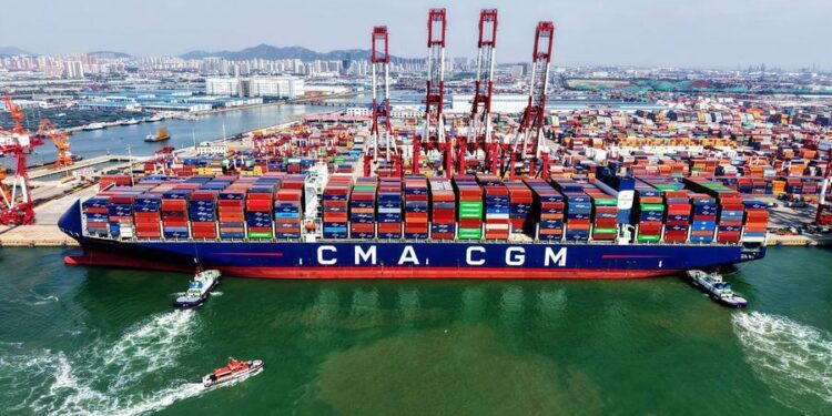An aerial drone photo taken on June 9, 2026 shows a cargo ship berthed at Qingdao Port in Qingdao, east China's Shandong Province.  (Photo by Yu Fangping/Xinhua)