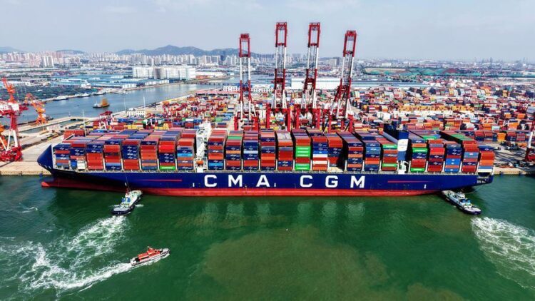 An aerial drone photo taken on June 9, 2026 shows a cargo ship berthed at Qingdao Port in Qingdao, east China's Shandong Province.  (Photo by Yu Fangping/Xinhua)