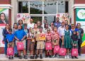 Executive Director of GNBS, Trevor Bassoo, flanked by finalists of the competition, teachers, parents and representatives from GNBS