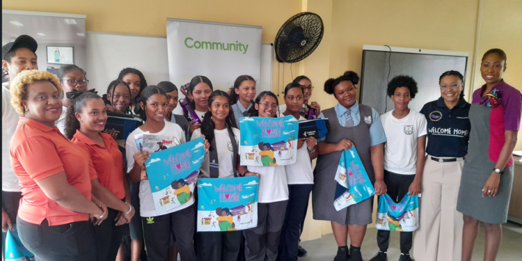 Students of Diamond Secondary share a light moment with Caribbean Airlines Country Manager for Guyana and Suriname (second right); FA Jamila Romany(first right) and other team members from the GTA, Shellon Nicholas, Senior Tourism Events Officer (first left) and Naliyah Lallbeharry GTA’s Marketing and Event Officer(second left)  following our Career Talk Session at the school on May 28.