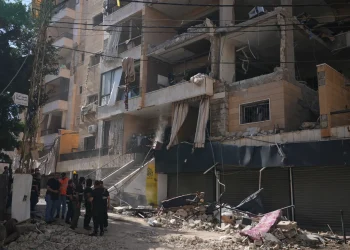 Lebanese security officers gather at the site where an Israeli airstrike hit a building in Dahiyeh, Beirut’s southern suburb, Lebanon, Sunday, June 7, 2026. (AP Photo/Hassan Ammar)