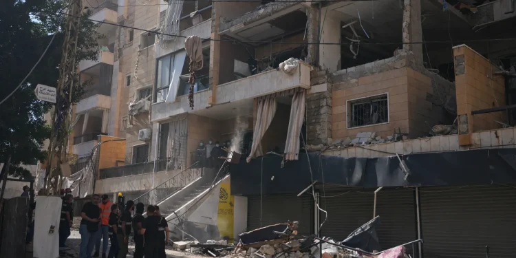 Lebanese security officers gather at the site where an Israeli airstrike hit a building in Dahiyeh, Beirut’s southern suburb, Lebanon, Sunday, June 7, 2026. (AP Photo/Hassan Ammar)
