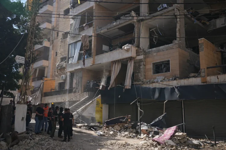Lebanese security officers gather at the site where an Israeli airstrike hit a building in Dahiyeh, Beirut’s southern suburb, Lebanon, Sunday, June 7, 2026. (AP Photo/Hassan Ammar)