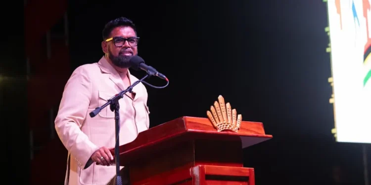 President Dr Mohamed Irfaan Ali addresses the opening ceremony of the International Building Expo at the Guyana National Stadium in Providence