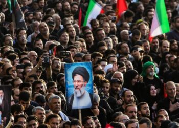 People attend a funeral ceremony for Iran's late Supreme Leader Ali Khamenei in Qom, Iran, July 7, 2026. (Mehr News Agency/Handout via Xinhua)