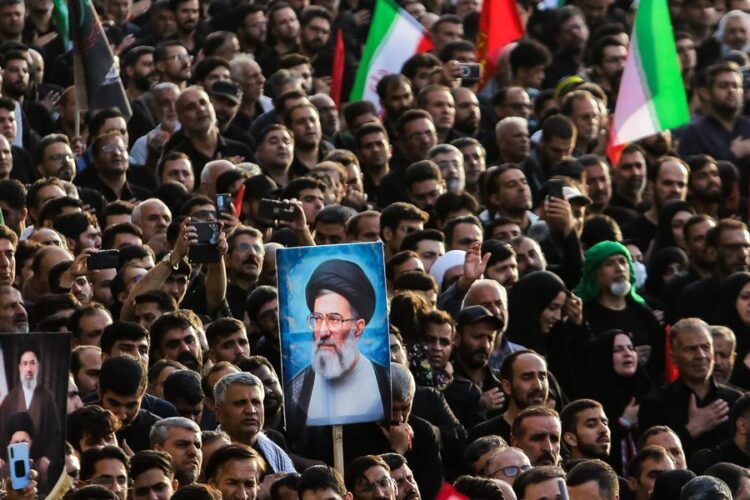People attend a funeral ceremony for Iran's late Supreme Leader Ali Khamenei in Qom, Iran, July 7, 2026. (Mehr News Agency/Handout via Xinhua)
