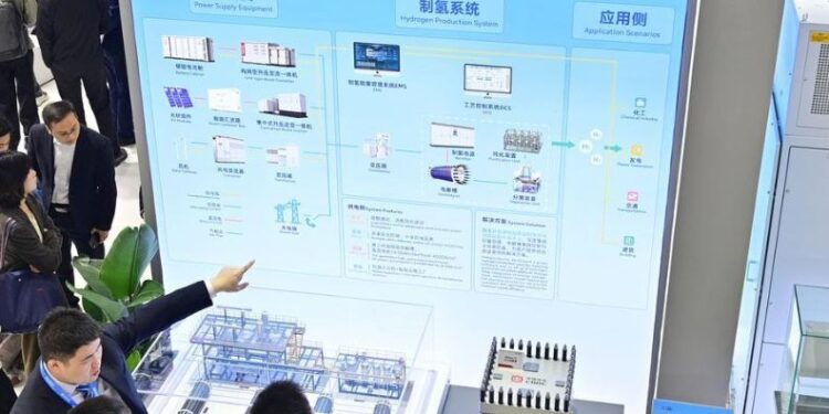 Visitors learn about the flexible green power hydrogen product solution of China Railway Rolling Stock Corporation (CRRC) during the 14th Energy Storage International Conference and Expo (ESIE) in Beijing, capital of China, April 2, 2026. (Xinhua/Yin Dongxun)