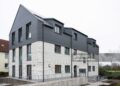 11 December 2024, North Rhine-Westphalia, Lünen: Completion of Germany's first publicly subsidized residential building from the 3D printer. North Rhine-Westphalia is leading the way in Germany with this pioneering project, bringing innovative construction and affordable housing under one roof. The construction project was financially supported as part of the state's "Innovation in the construction industry" funding and the North Rhine-Westphalia public housing promotion program. Photo: Guido Kirchner/dpa (Photo by Guido Kirchner/picture alliance via Getty Images)