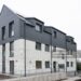 11 December 2024, North Rhine-Westphalia, Lünen: Completion of Germany's first publicly subsidized residential building from the 3D printer. North Rhine-Westphalia is leading the way in Germany with this pioneering project, bringing innovative construction and affordable housing under one roof. The construction project was financially supported as part of the state's "Innovation in the construction industry" funding and the North Rhine-Westphalia public housing promotion program. Photo: Guido Kirchner/dpa (Photo by Guido Kirchner/picture alliance via Getty Images)
