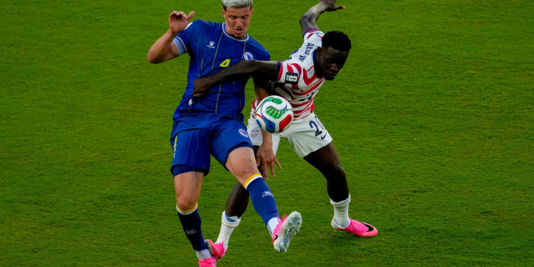 United States' Folarin Balogun (R) fouls Bosnia and Herzegovina's Tarik Muharemovic during the World Cup round of 32 soccer match between the United States and Bosnia in Santa Clara, California, US, July 1, 2026. /VCG
