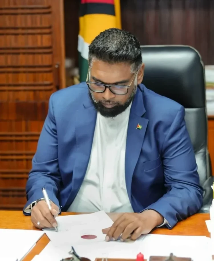 President Dr Irfaan Ali signs the Guyana Development Bank Act