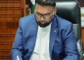 President Dr Irfaan Ali signs the Guyana Development Bank Act