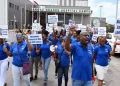 FLASHBACK: Idi Stuart, right, president of the Trinidad and Tobago National Nurses Association, leads nurses in a protest in the car park of the Sangre Grande Hospital Campus in March. —Photo: CURTIS CHASE