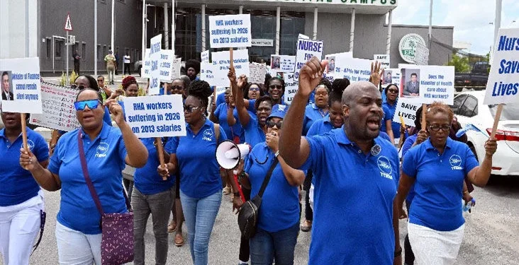 FLASHBACK: Idi Stuart, right, president of the Trinidad and Tobago National Nurses Association, leads nurses in a protest in the car park of the Sangre Grande Hospital Campus in March. —Photo: CURTIS CHASE