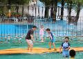 People have fun on a lake in Xiaying town of Jizhou district, North China's Tianjin, July 8, 2026. [Photo/Xinhua]