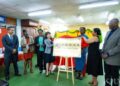 University of Guyana Vice-Chancellor, Professor Paloma Mohamed Martin, and China’s Ambassador to Guyana, Her Excellency Yang Yang, remove the ceremonial covering to officially unveil the China Book Corner signage at the University of Guyana Library, Turkeyen Campus. They are joined by senior members of the University of Guyana, representatives of the Embassy of the People’s Republic of China in Guyana, and a student of the University during the unveiling ceremony on Monday, 15 June 2026.