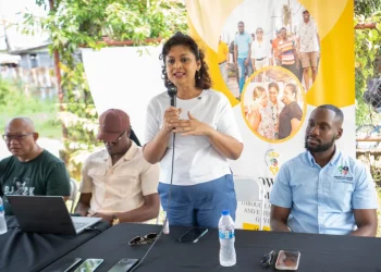 Minister of Local Government and Regional Development Priya Manickchand speaks with vendors at the East Ruimveldt market