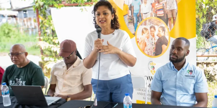 Minister of Local Government and Regional Development Priya Manickchand speaks with vendors at the East Ruimveldt market