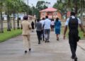Police officers first entered the property, arriving by Guyana Police Force river patrol boat through Mohamed’s wharf from the Demerara River. After gaining access, they opened the entry gates from inside the property to facilitate the arrival of the remaining officers. (Team Mohamed's photo)