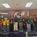 Prize Winners for the Junior Chess Championship Qualifiers posed with Ms. Yulanda Armstrong from EnerMech Guyana