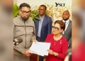 President Dr Mohamed Irfaan Ali hands over a Global Biodiversity Alliance membership certificate to Trinidad and Tobago’s Prime Minister Kamla Persad-Bissessar