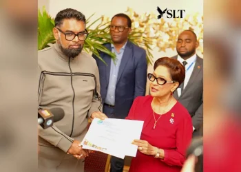 President Dr Mohamed Irfaan Ali hands over a Global Biodiversity Alliance membership certificate to Trinidad and Tobago’s Prime Minister Kamla Persad-Bissessar