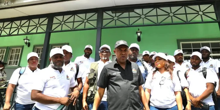 Members of Haiti’s government with the 31-person volunteer medical mission prepare to board a flight to Venezuela on July 7, carrying 5.5 tons of medical supplies to assist communities affected by twin earthquakes.
