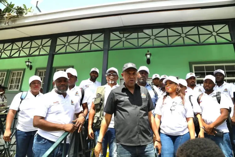 Members of Haiti’s government with the 31-person volunteer medical mission prepare to board a flight to Venezuela on July 7, carrying 5.5 tons of medical supplies to assist communities affected by twin earthquakes.