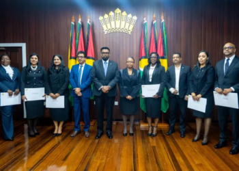 President Irfaan Ali, flanked by Attorney General Mohabir Anil Nandlall, SC, and the six newly appointed Puisne Judges