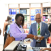 Chief Immigration Officer of Barbados purchasing at Guyana’s duty-free shop using her e-ID card (DPI photo)
