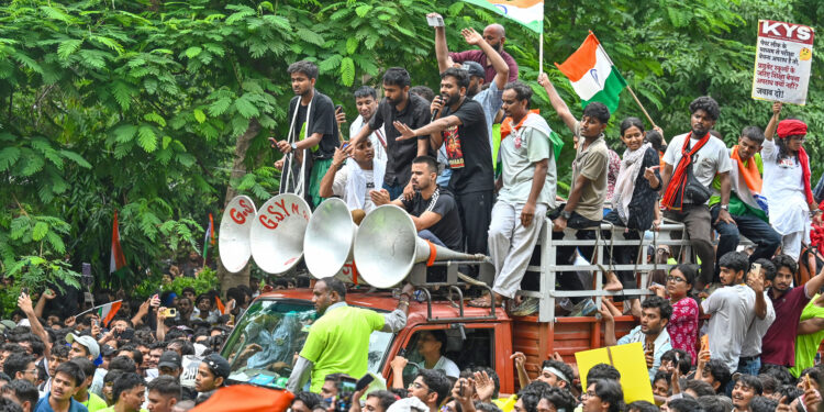 NEW DELHI, INDIA - JULY 20: Abhijeet Dipke, founder of the Cockroach Janta Party (CJP), participates in a protest march towards Parliament from Jantar Mantar on July 20, 2026 in New Delhi, India. The march, held amid heavy security arrangements, drew thousands of supporters demanding action over alleged examination paper leaks and reforms in the education system. (Photo by Sanchit Khanna/Hindustan Times via Getty Images)