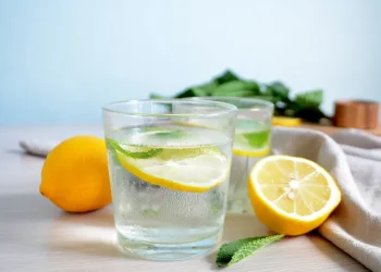 Drinking lemon water is a flavorful way to stay hydrated throughout the day.
credit: Mariya Volkova / Getty Images