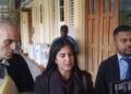 Attorneys Siand Dhurjon and Damien DaSilva with Hana Mohamed outside of the court room. (Kaieteur News photo)