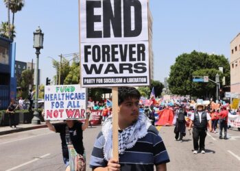 Demonstrators holding placards take part in a May Day rally in Los Angeles, California, the United States, on May 1, 2026. (Photo by Qiu Chen/Xinhua)