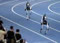 Robots of Tiangong compete during the 4x100m Relay of the 2nd World Humanoid Robot Games in Beijing, capital of China, Aug. 25, 2026. (Xinhua/Zhang Chenlin)