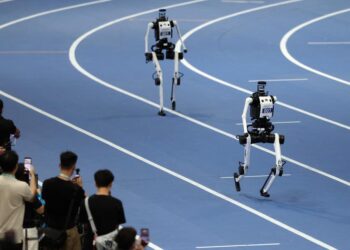 Robots of Tiangong compete during the 4x100m Relay of the 2nd World Humanoid Robot Games in Beijing, capital of China, Aug. 25, 2026. (Xinhua/Zhang Chenlin)