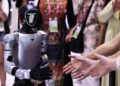 Visitors interact with a robot from Unitree Robotics during the sixth China International Consumer Products Expo (CICPE) in Haikou, South China's Hainan province, April 14, 2026. [Photo/Xinhua]
