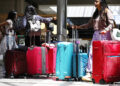 Travelers gathered with their luggage at the international terminal of Los Angeles International Airport, on June 23, 2024. /CFP